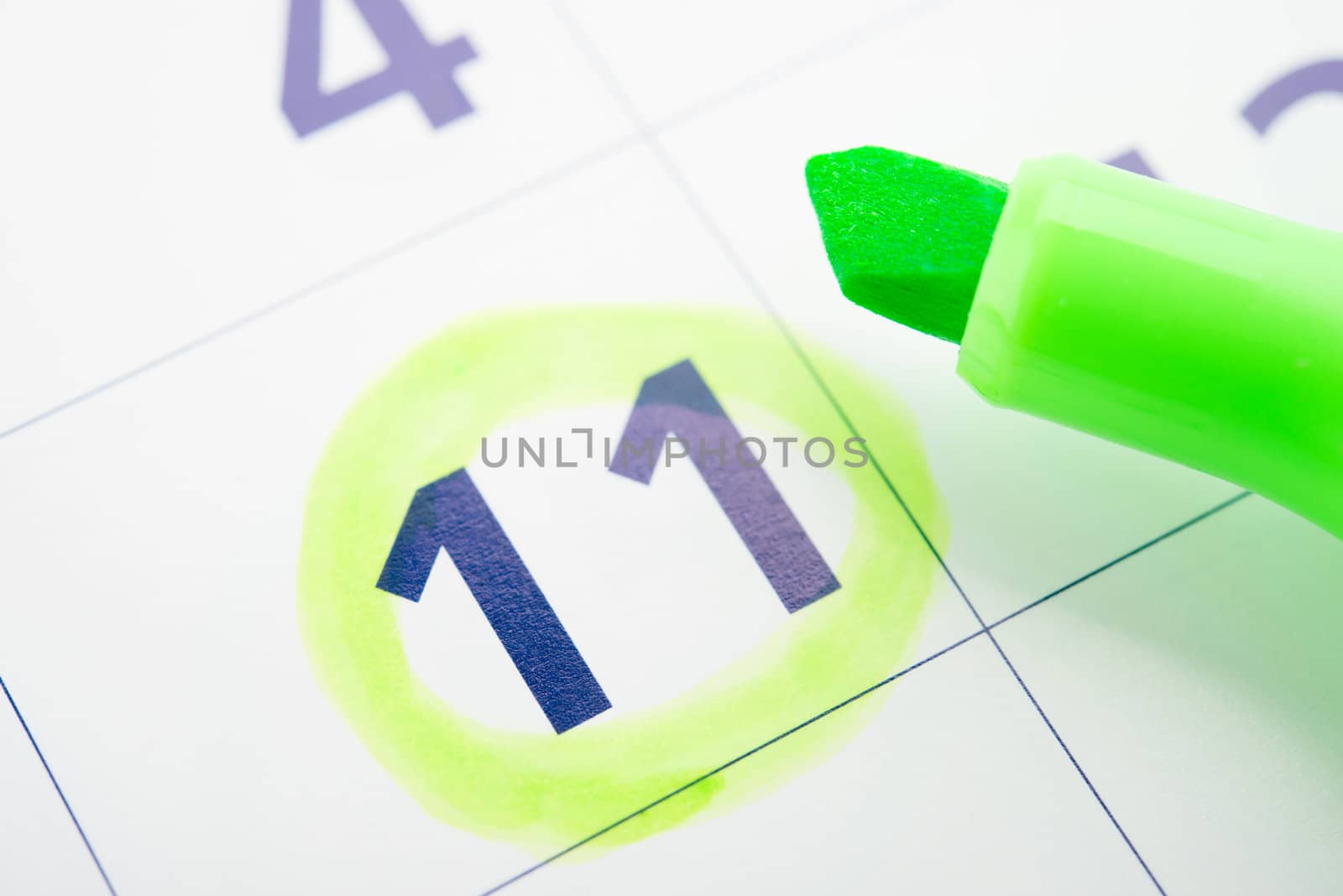 Green marker and open calendar