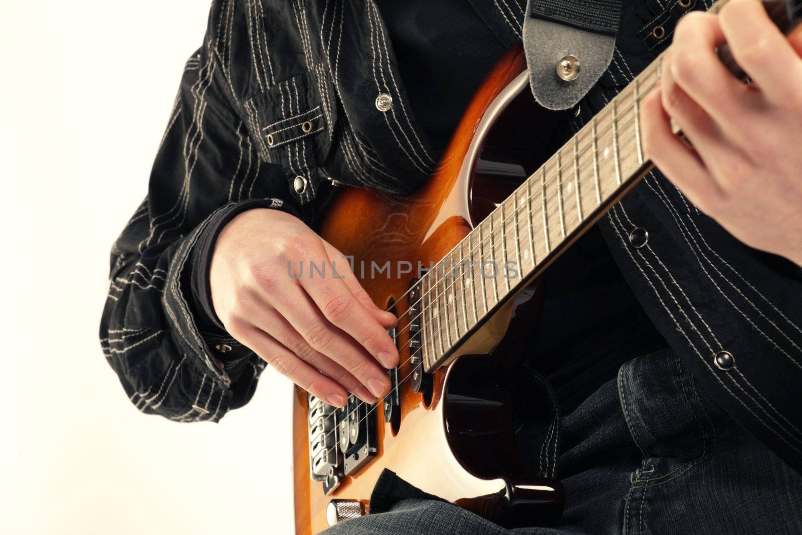 guitarist playing electric guitar by stokkete