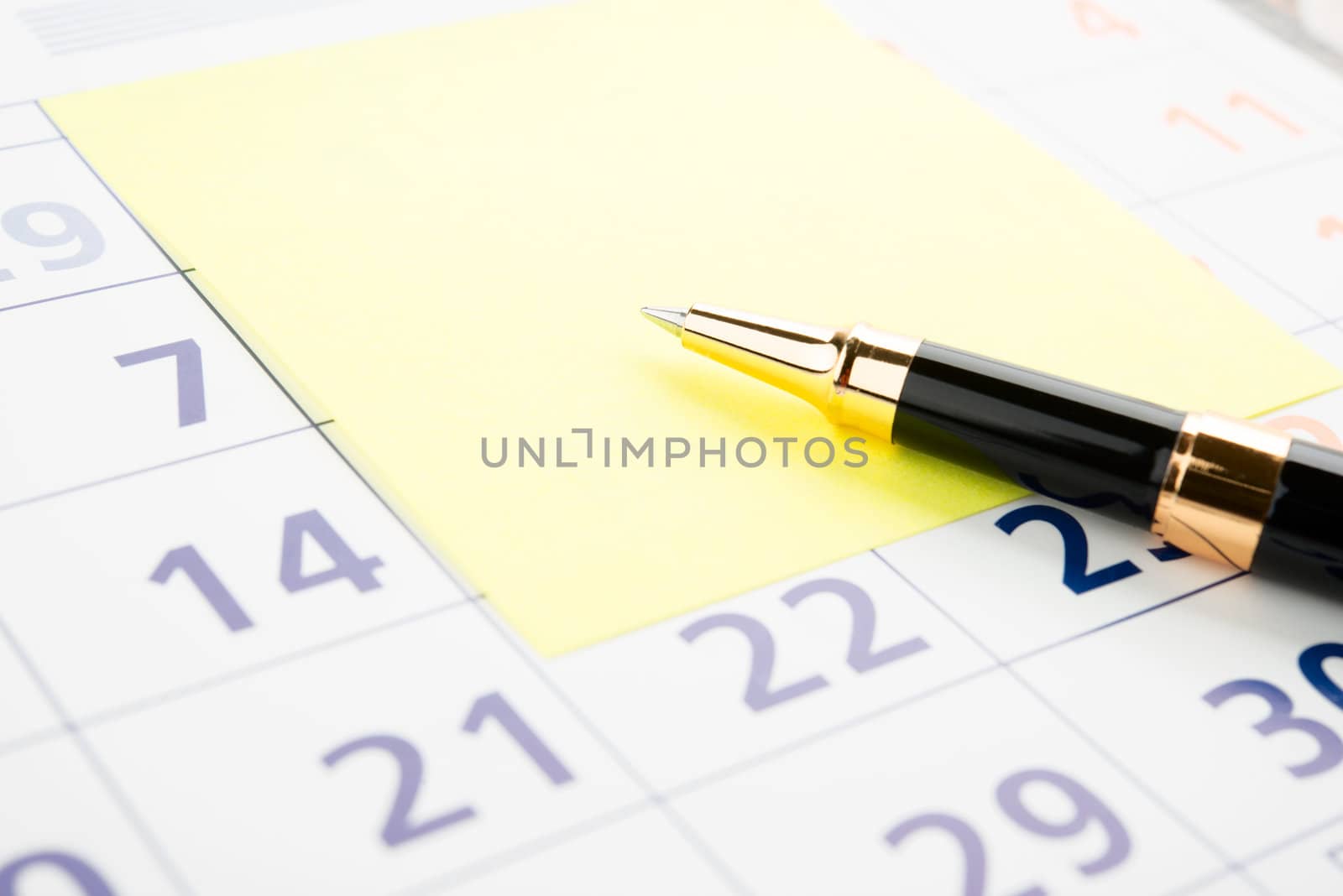 Closeup of a sticky note on a calendar