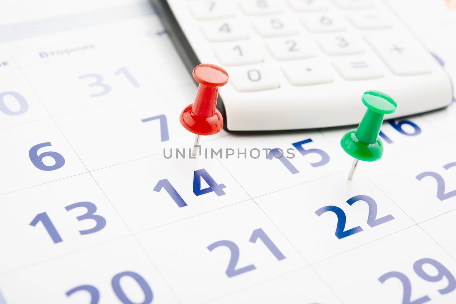 push pin in calendar with calculator