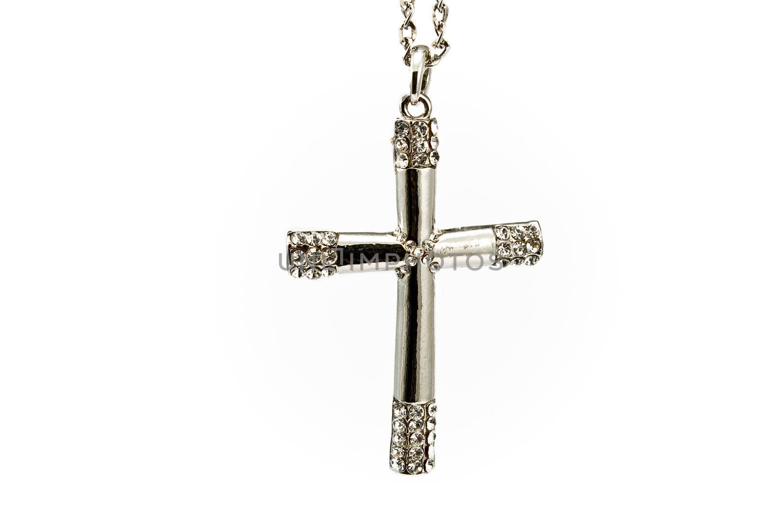 Silver christian cross with small diamonds isolated on white