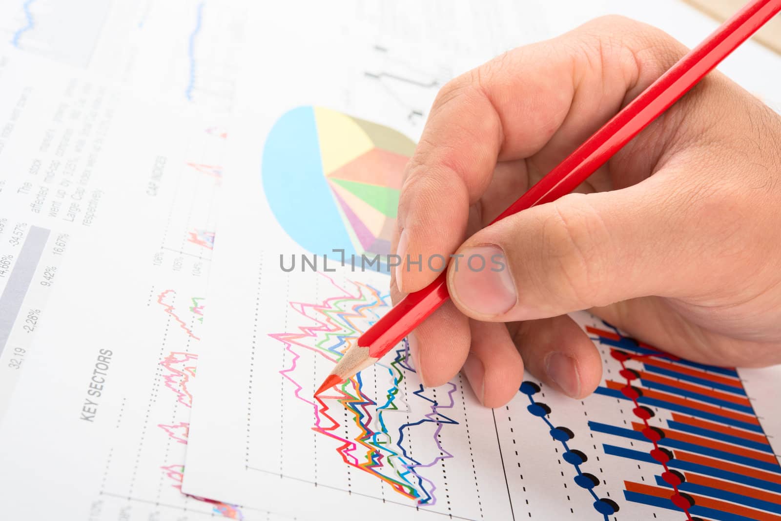 Analysing company year report with graphs and pencil