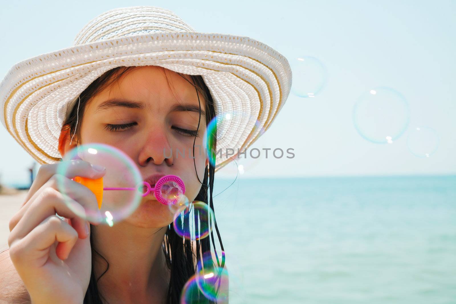 Teen girl blowing bubbles by AndreyKr