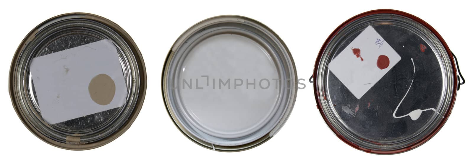 The tops of three paint cans isolated on white with copy space for text.
