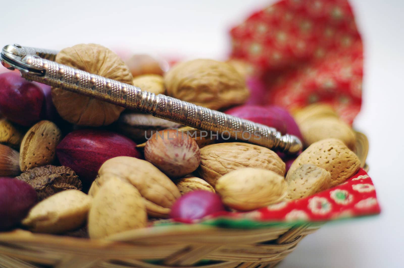 Close up Nuts and a nut cracker in a basket