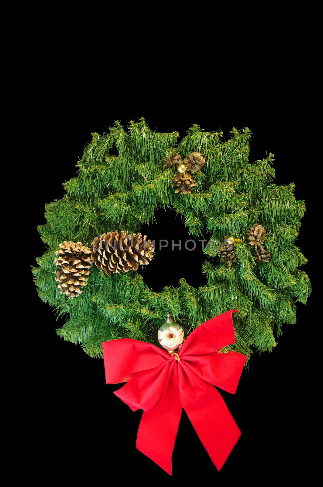 A Green Christmas wreath with a red bow