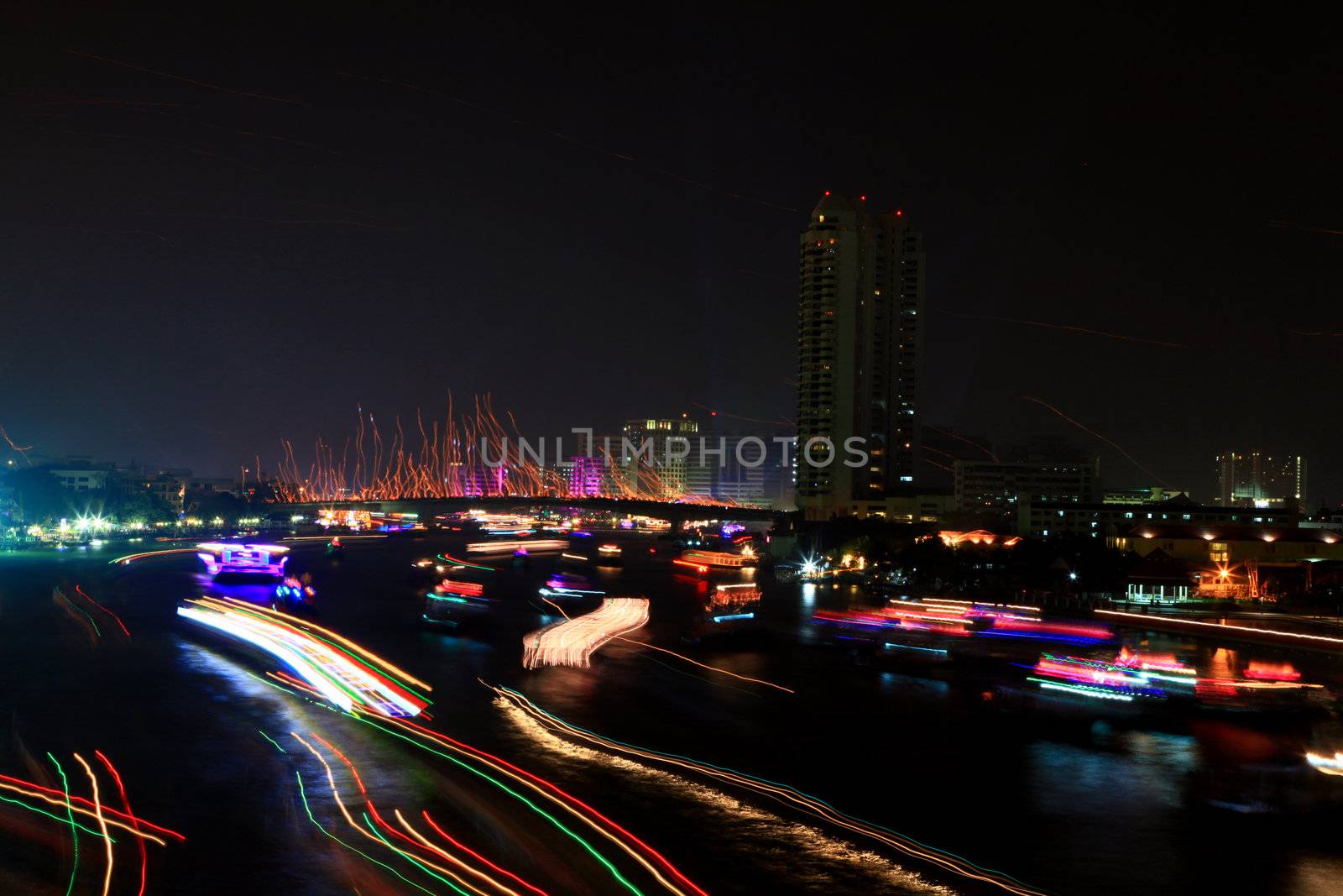 Colorful river with light trail from ship over Chao Phraya River on Father's Day in Thailand