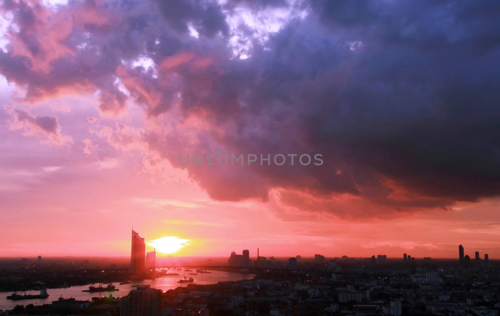 Beautiful Sunset in Bangkok Thailand from top View with Coludy Sky