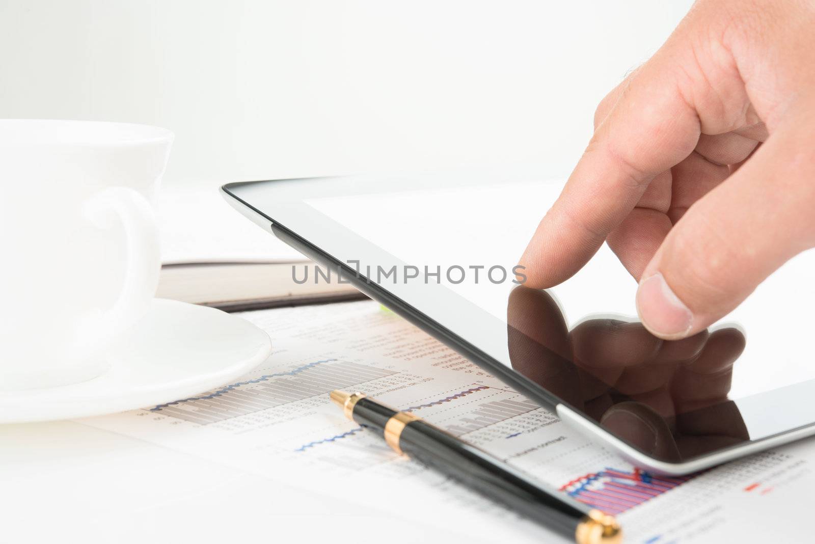 Hand touching screen of tablet pc by Emevil