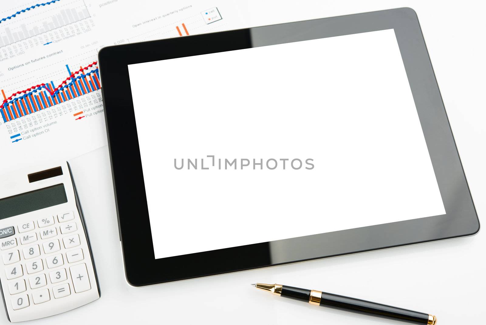Tablet computer with blank screen on a businessman workplace