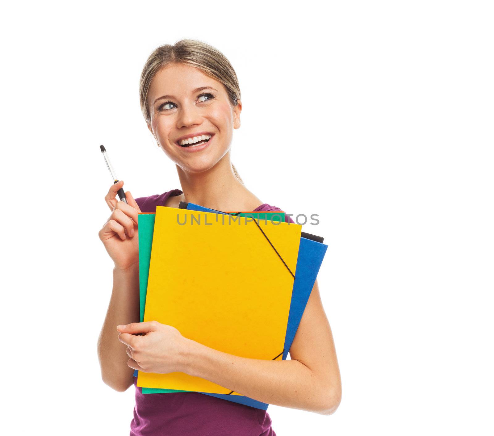 Young blond woman holding folders, smiling and looking up, on white