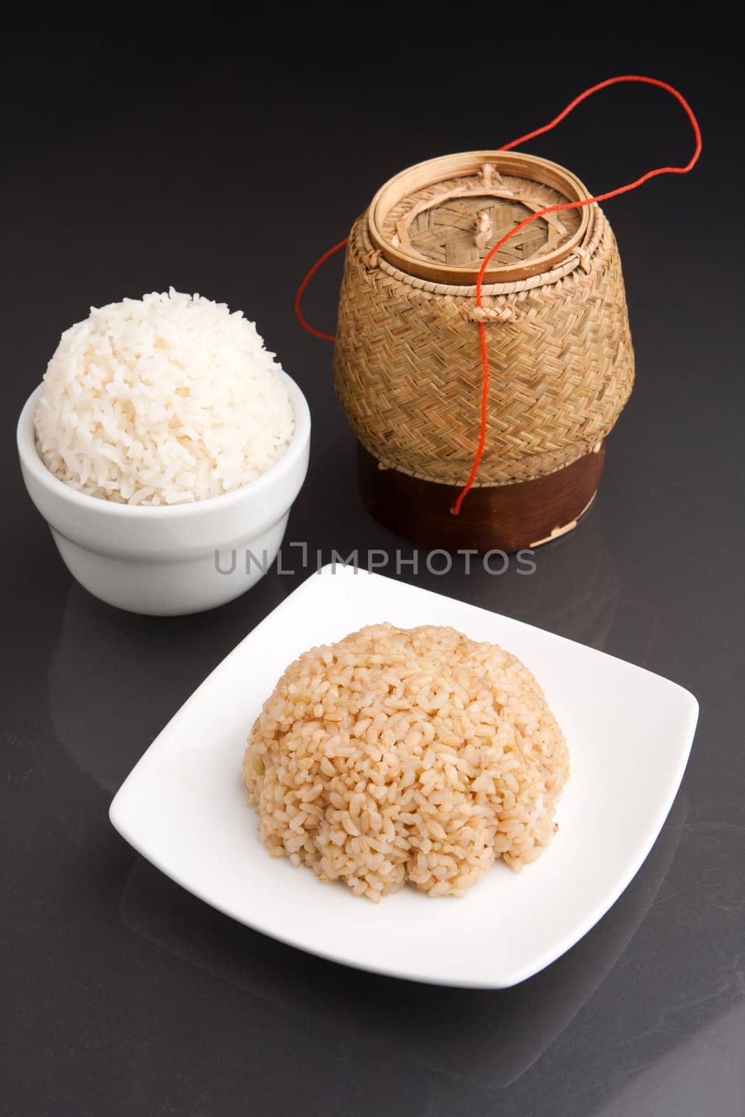 Different kinds of Thai style rices prepared including white jasmine and brown rice.