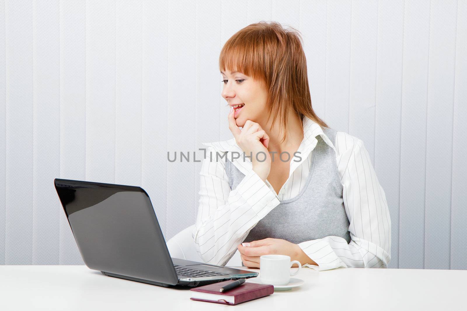 smiling attractive girl with a notebook. Office worker