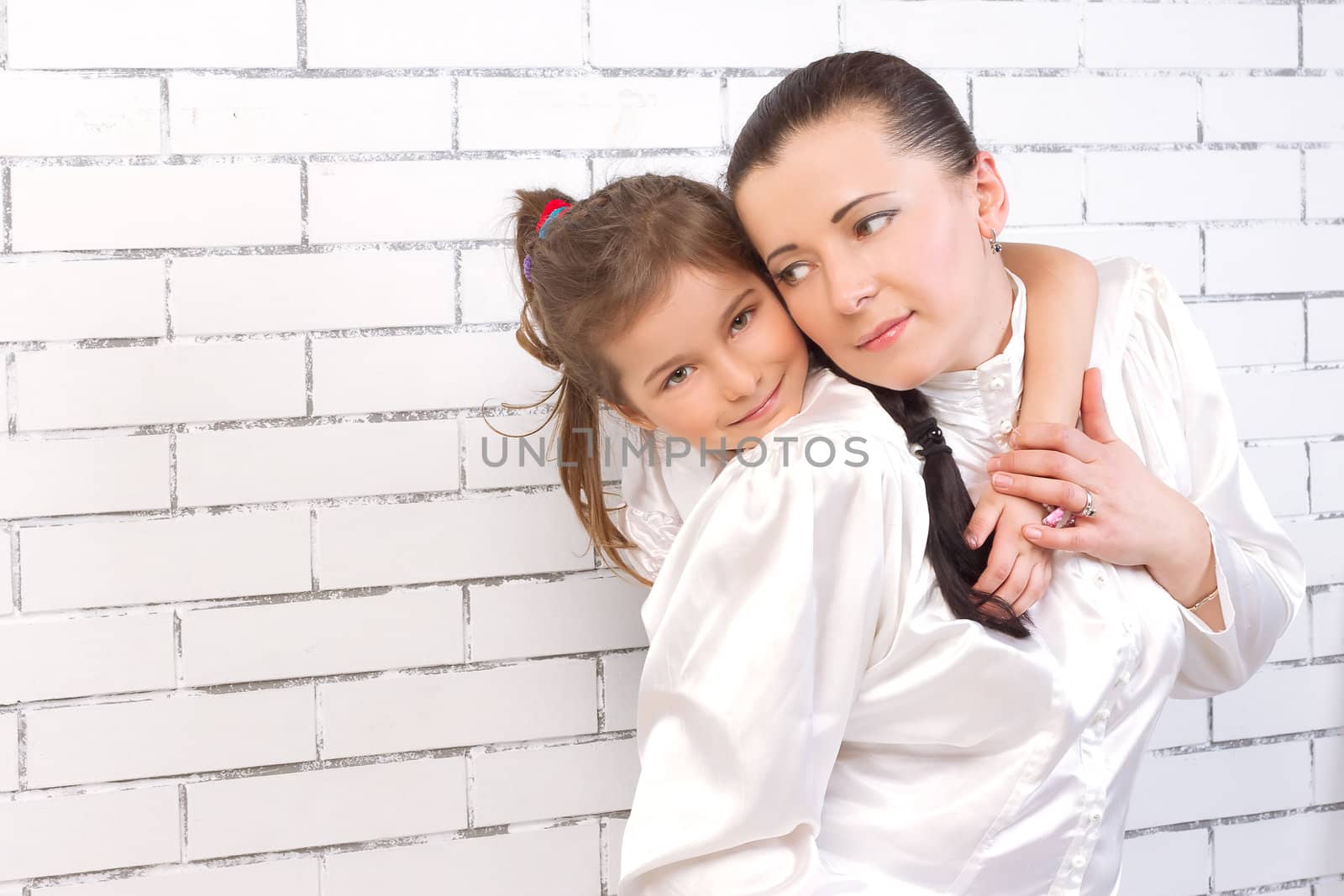 girl in white dress hugging her mom by victosha