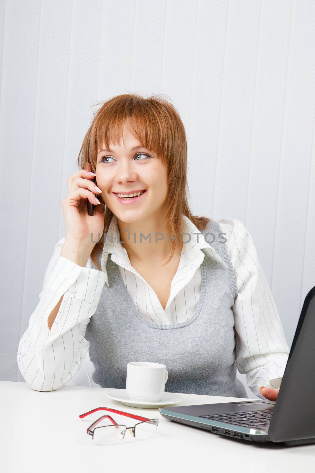 Attractive happy girl talking on the phone