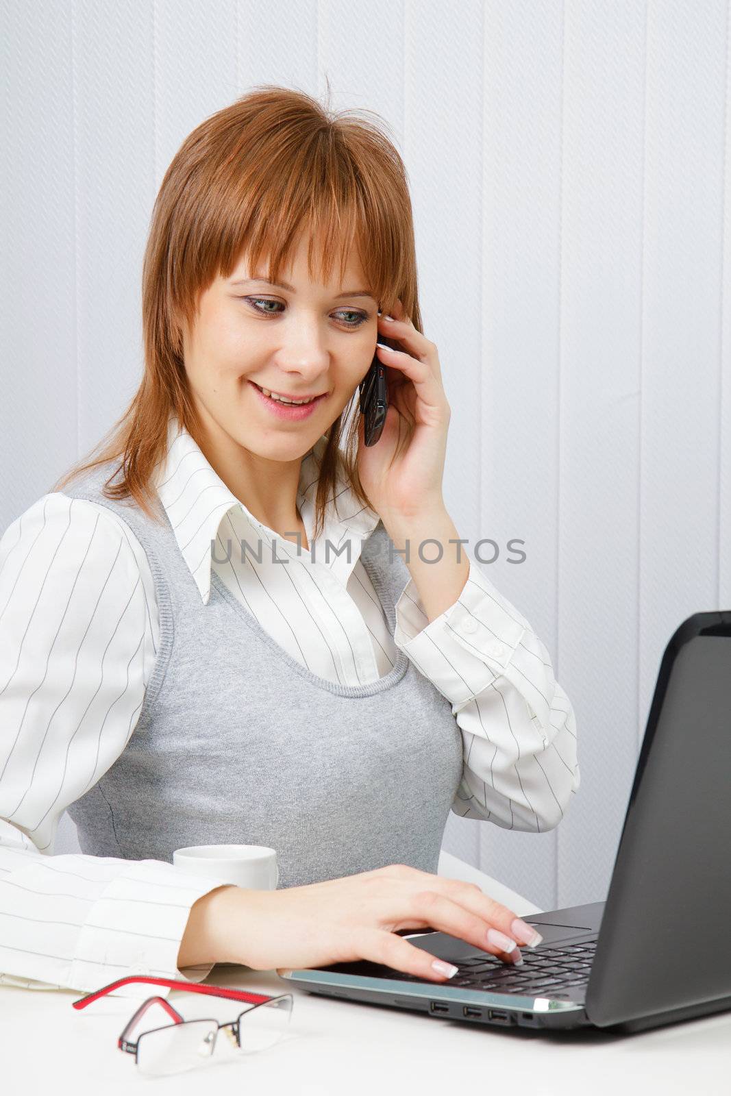 Attractive happy girl talking on the phone