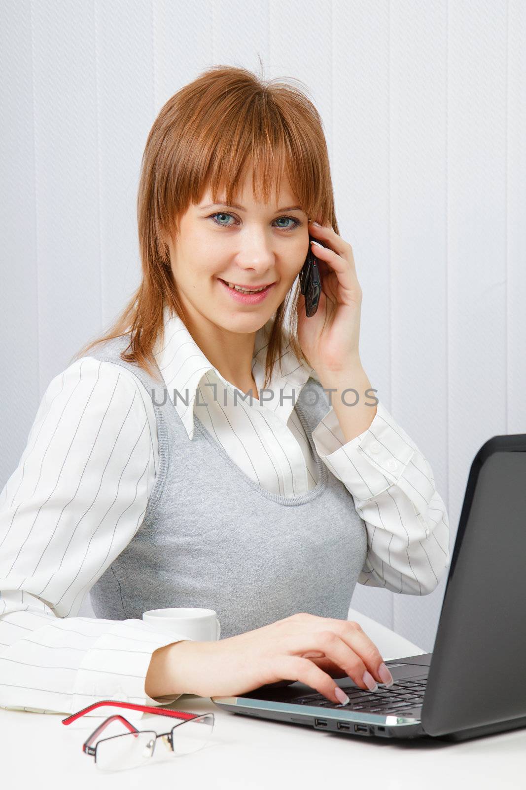 Attractive happy girl talking on the phone