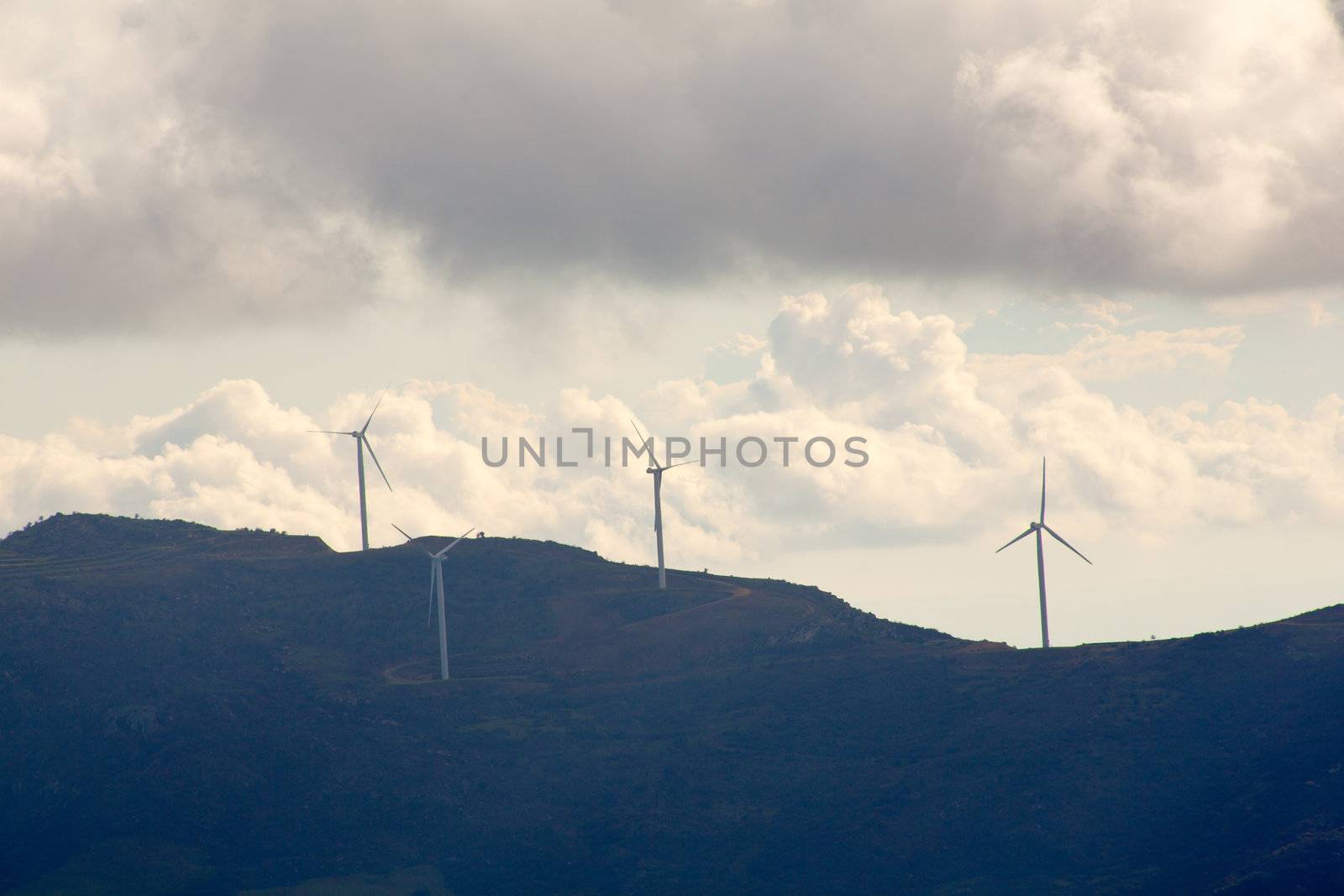 View of Wind turbines in the mountain with clouds