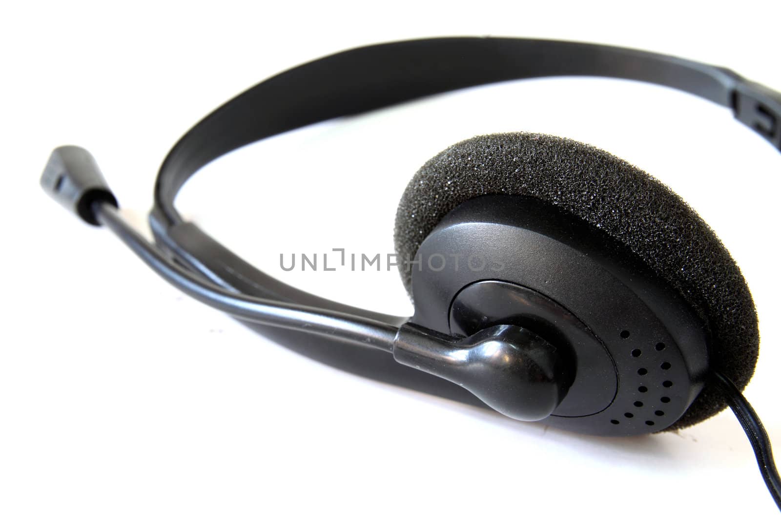 Close up of black headphones isolated on white background