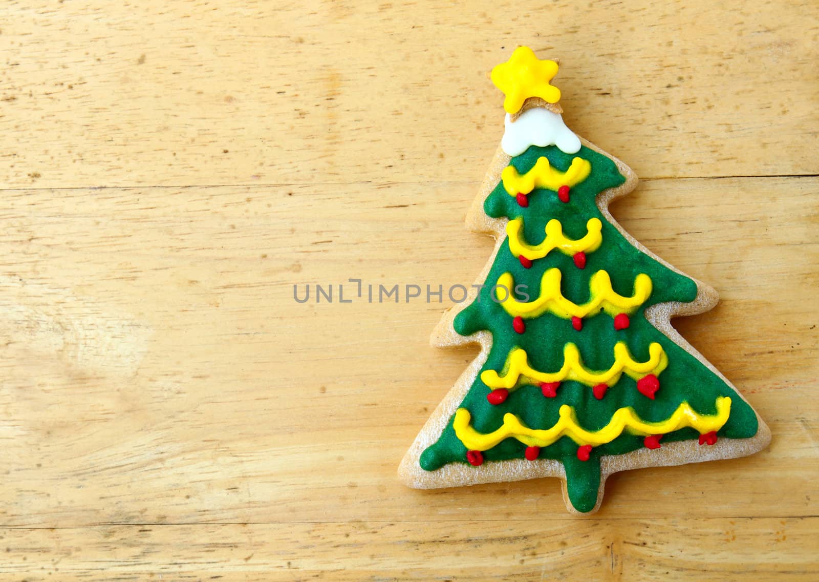 Decorated christmas gingerbread on wooden background by nuchylee