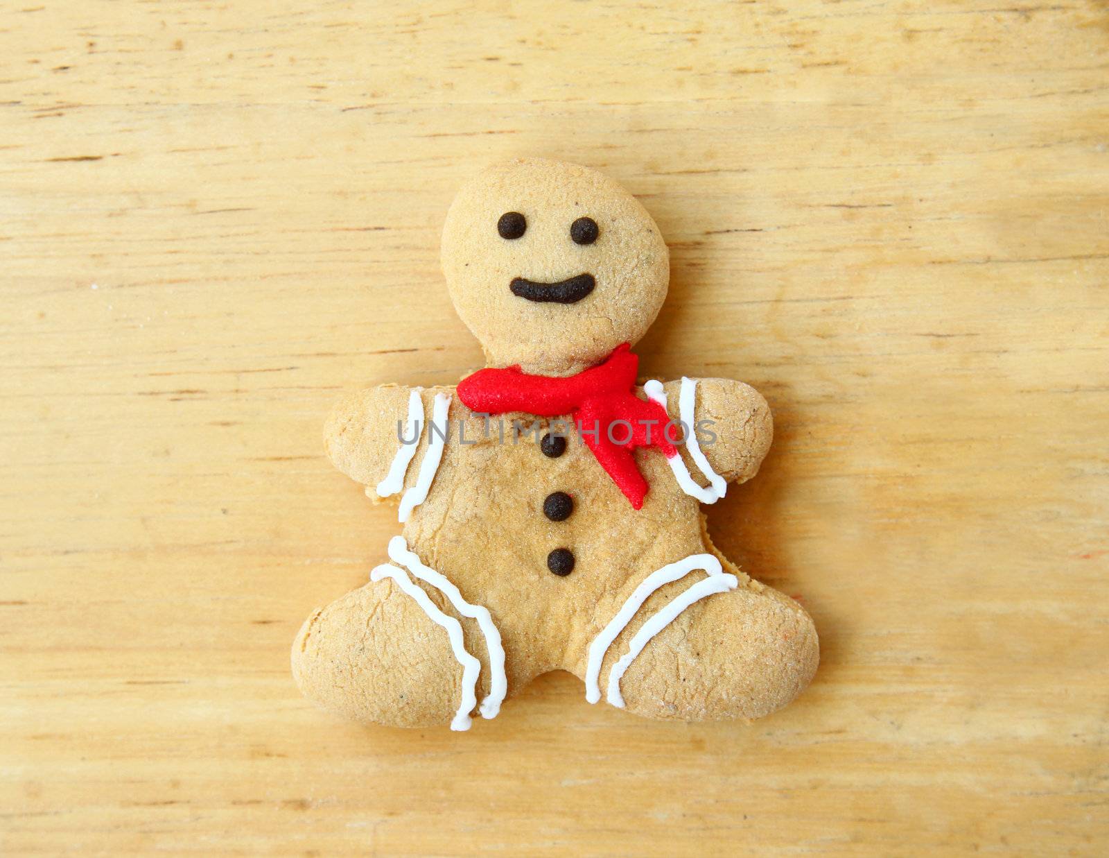 Gingerbread man on wooden background by nuchylee