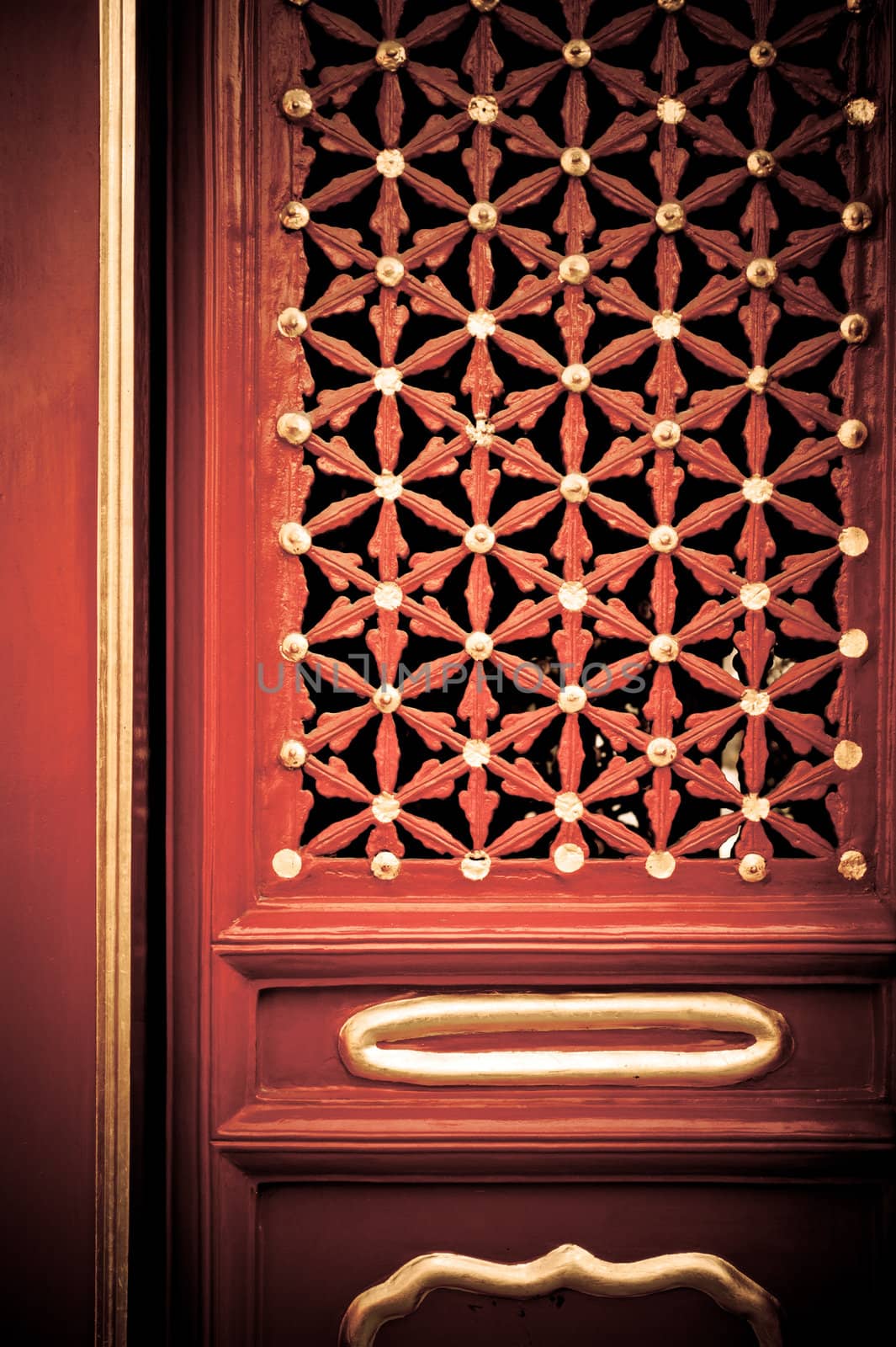 A red painted wood door with gold and brass painted decorations.







A gold and brass painted Chinese door, in red wood.