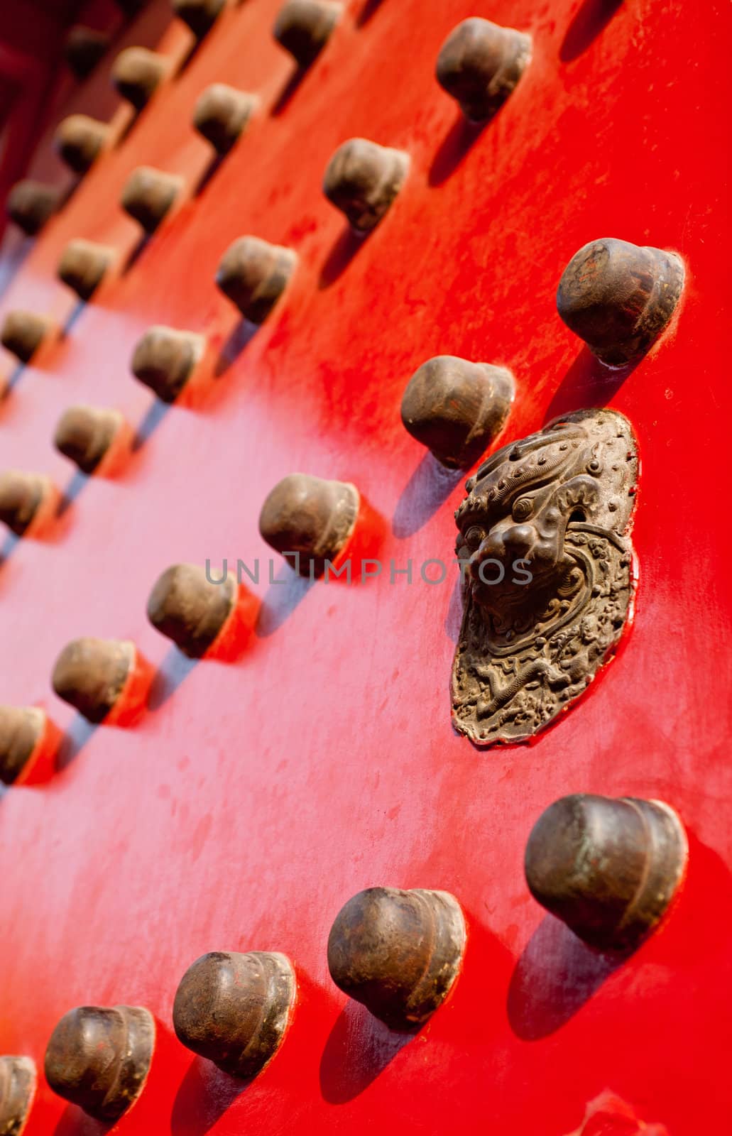 Red gate for an entry into the Imperial Palace in Beijing, China.