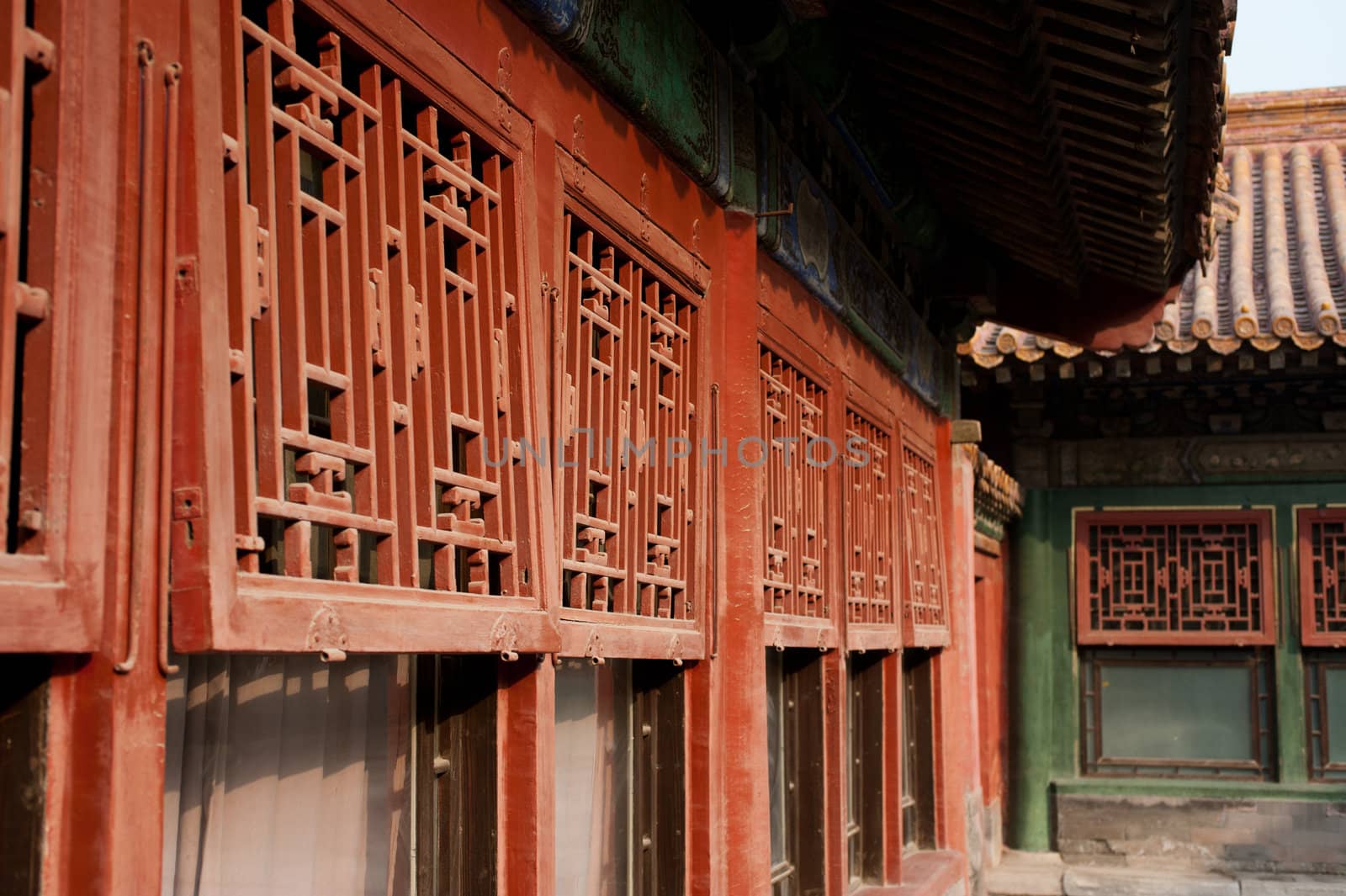 Red shutters in a Chinese palace.