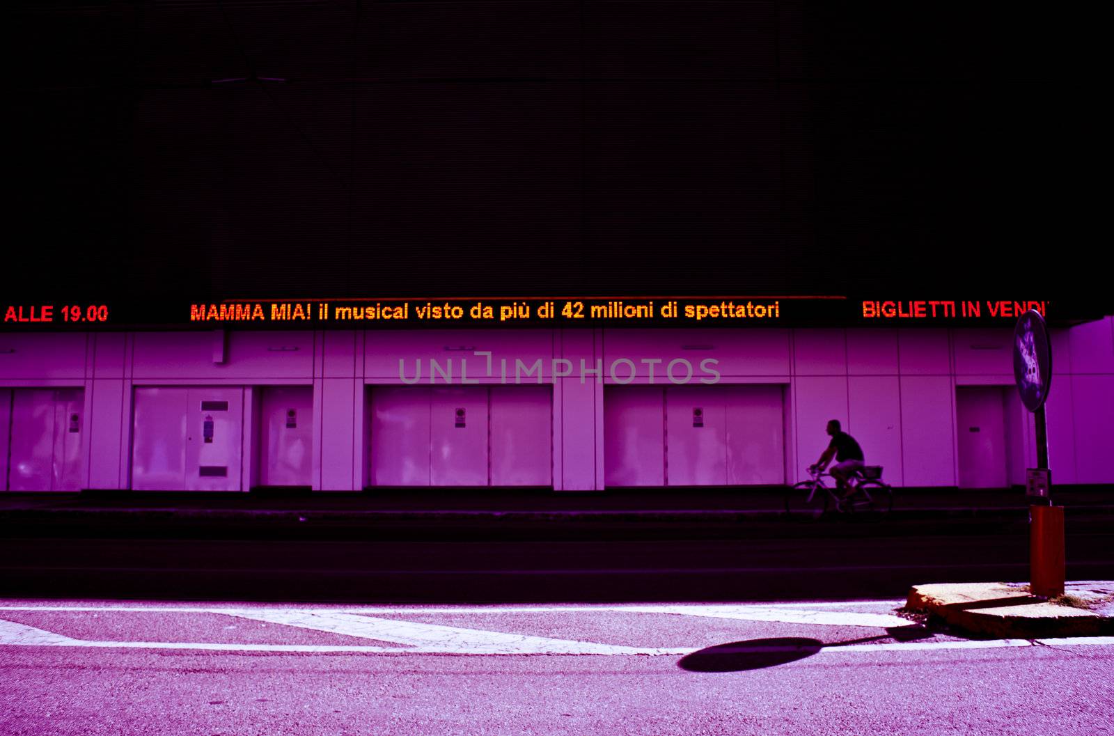 Man in bike on the street in the city of Milan - Italy