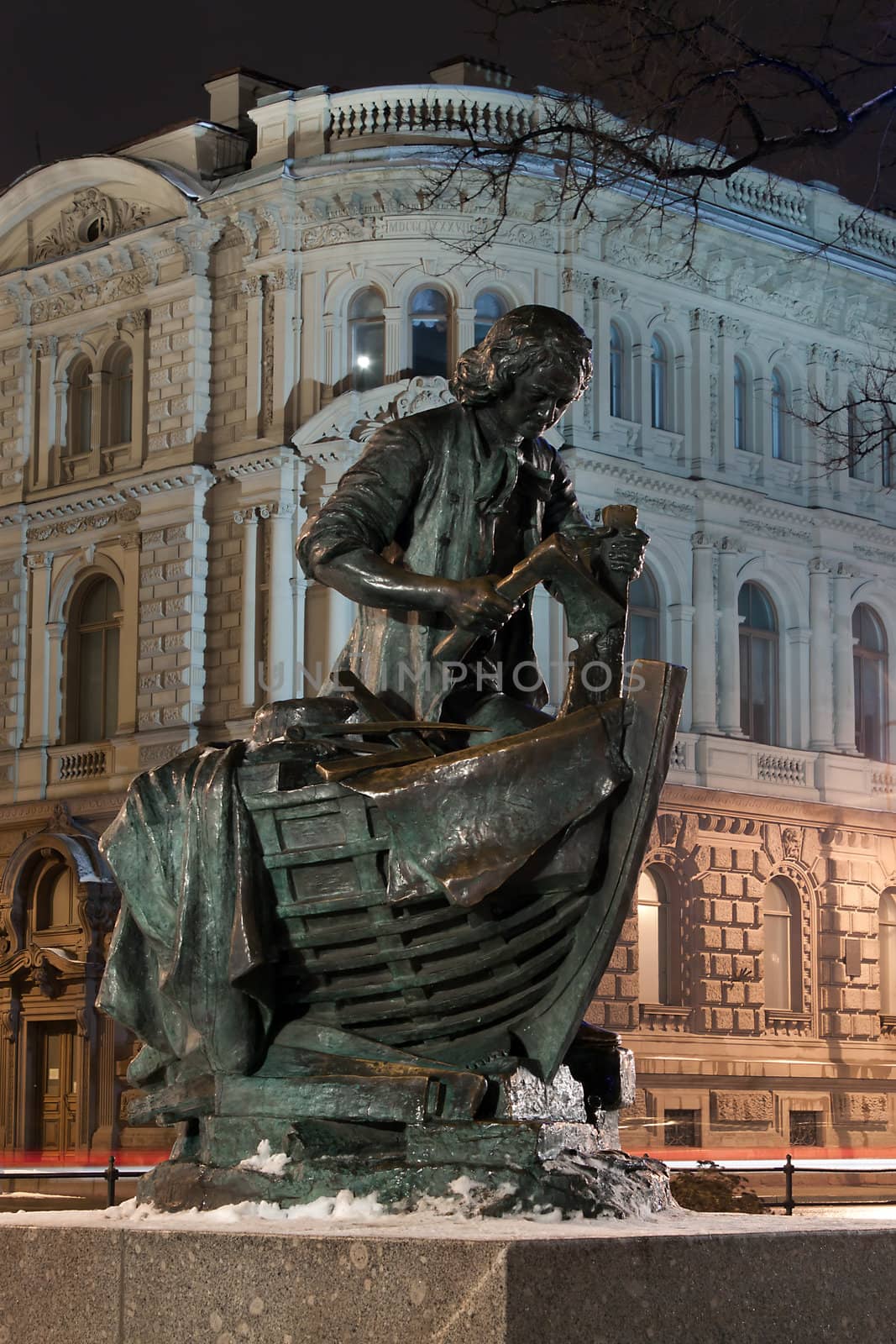 Verical view of Bronze statue Peter the Great carpenter at night, St. Petersburg, Russia