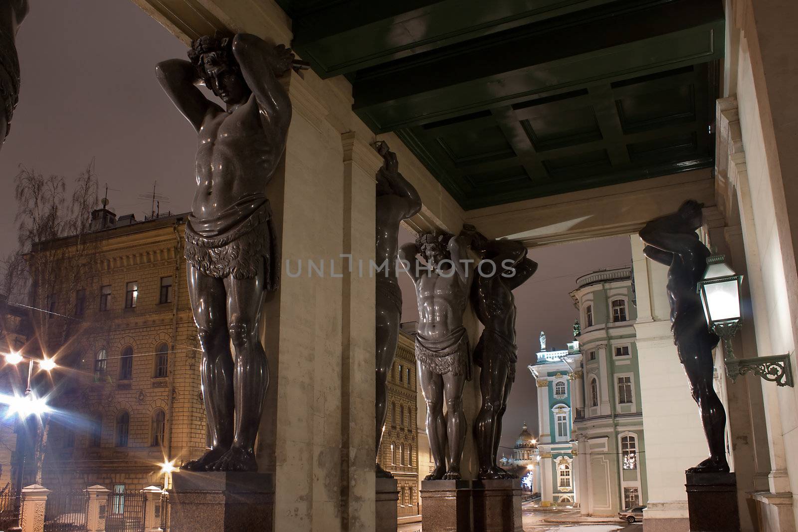 Night view of Granite Atlases Guarding the Hermitage in St. Petersburg, Russia