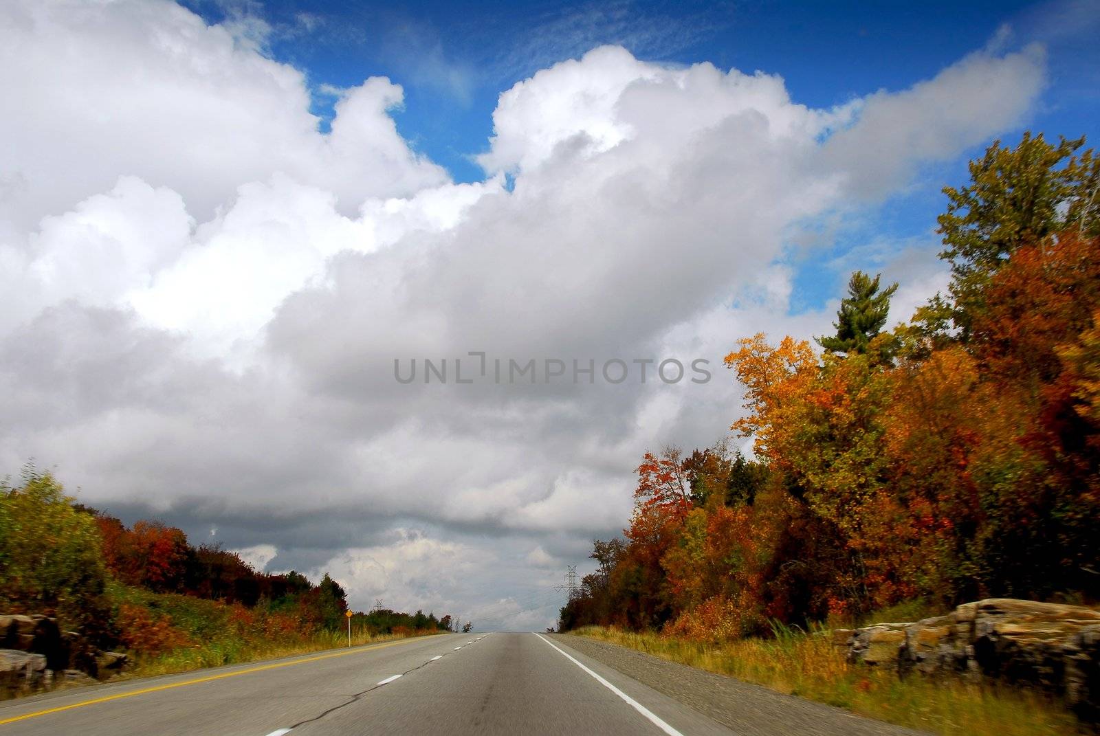 Divided highway in the fall, some motion blur on the sides