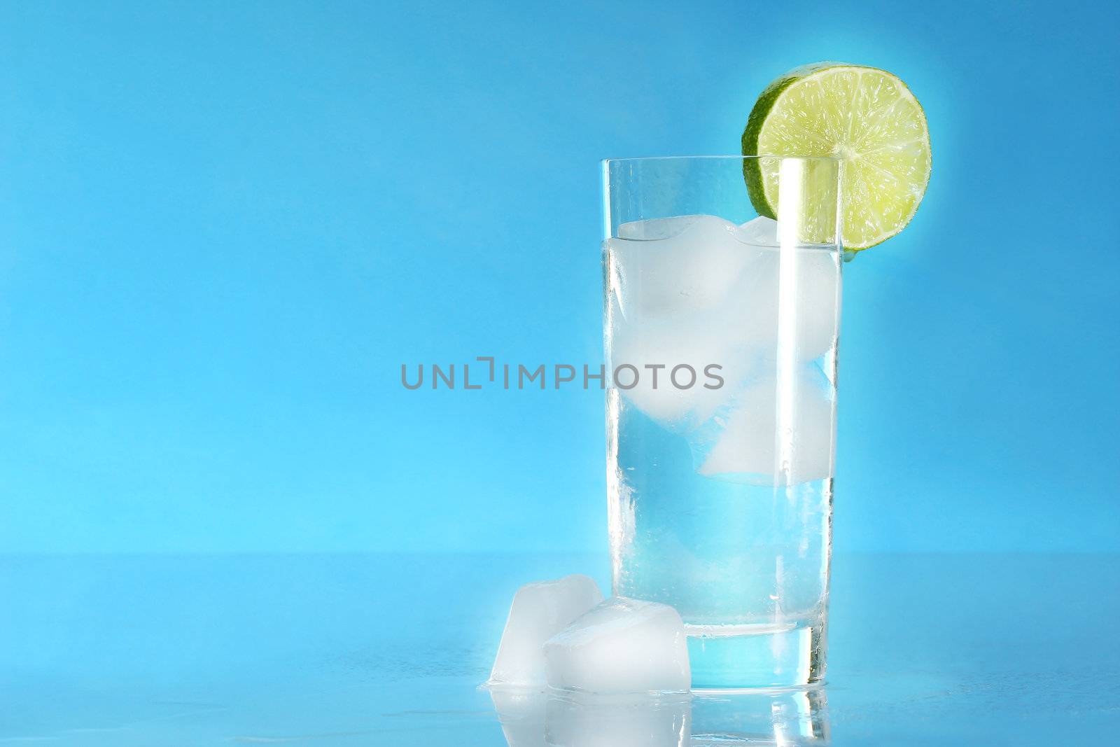 Glass of cold water with ice cubes