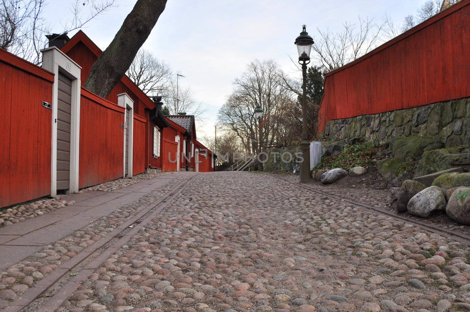 A cobbled street with old buildings in Stockholm.