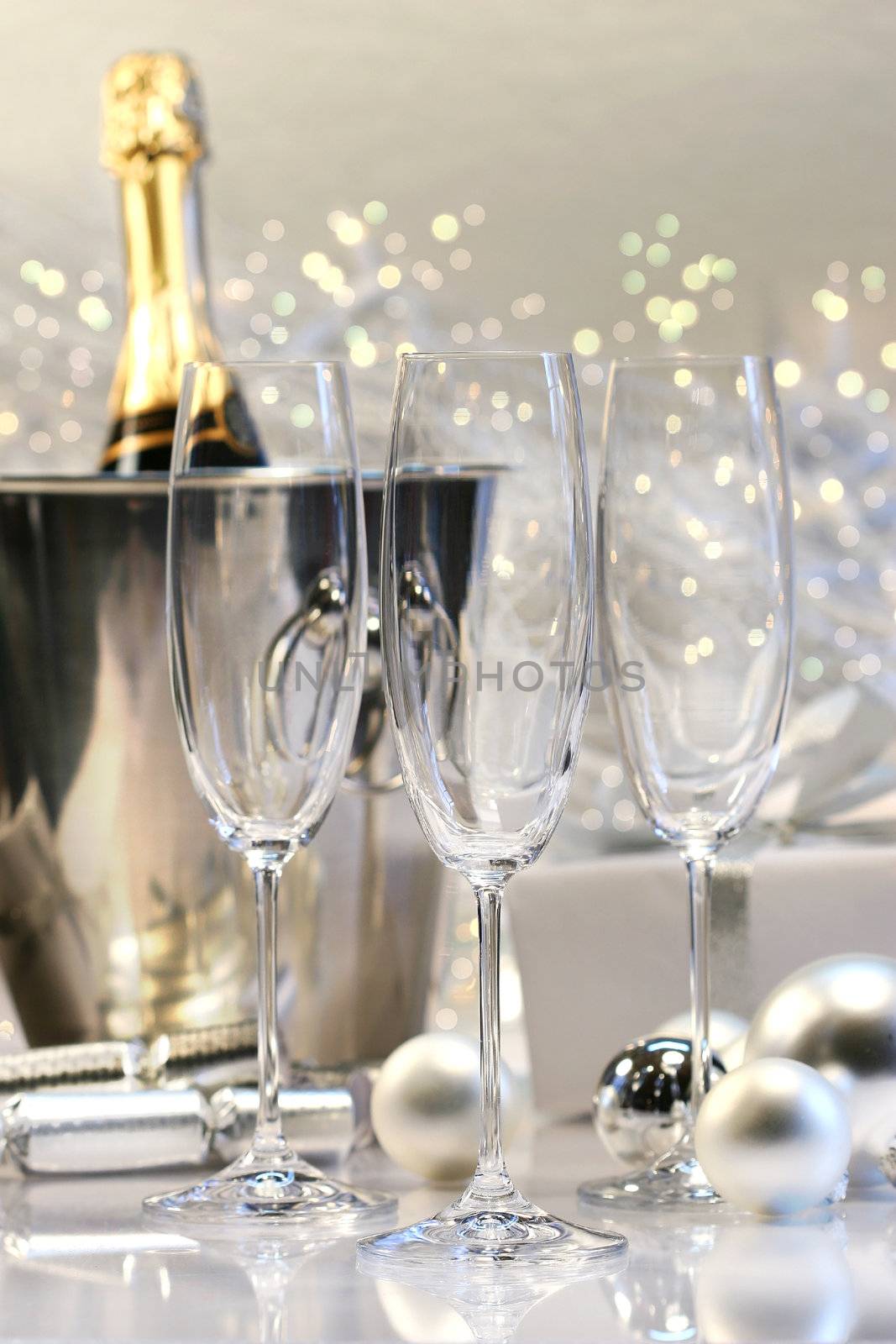 Three empty champagne glasses ready to be filled 