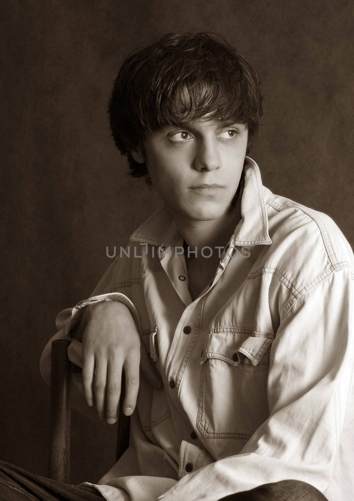 Portrait of the young in studio. b/w+sepia