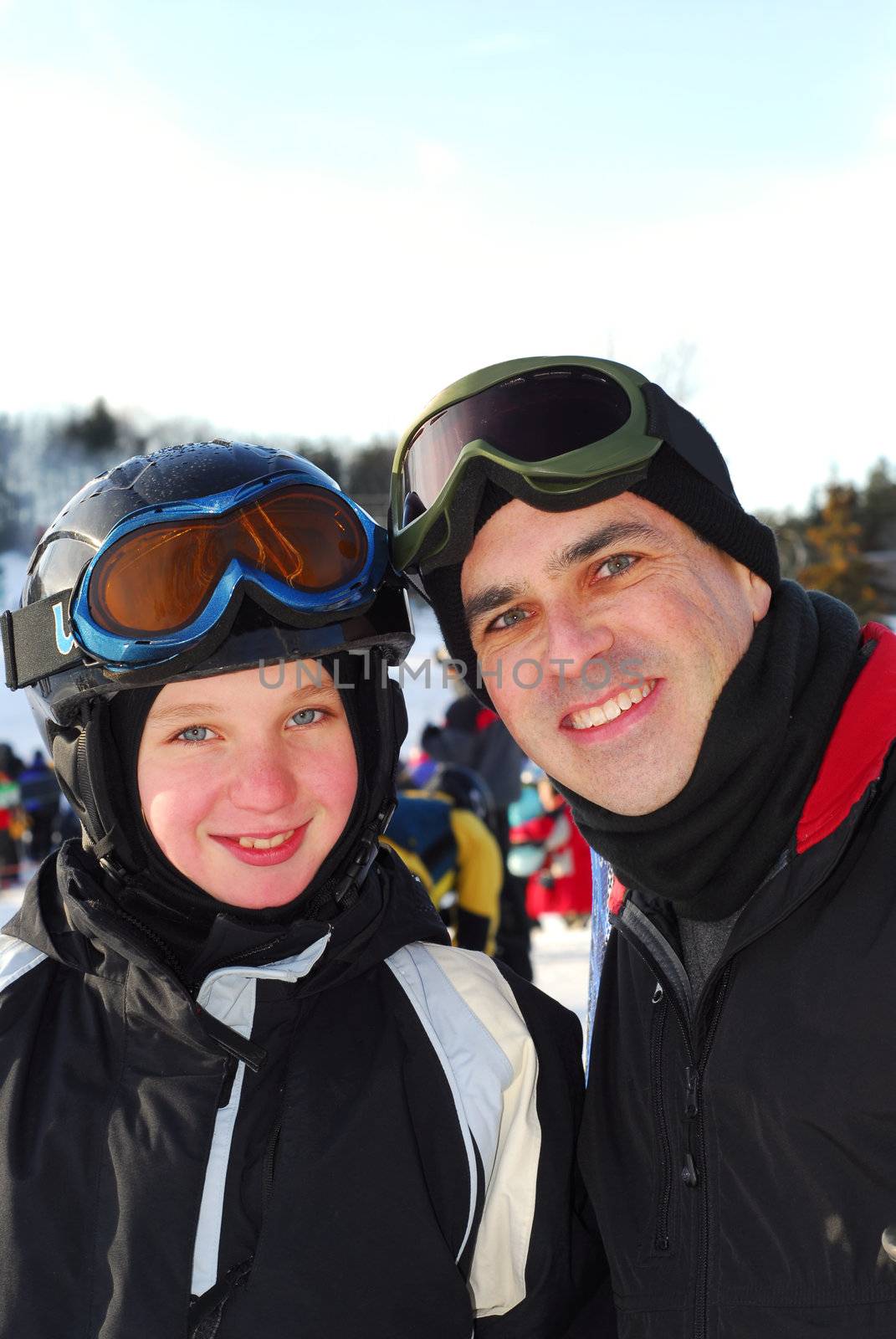 Portrait of a happy family on downhill ski resort