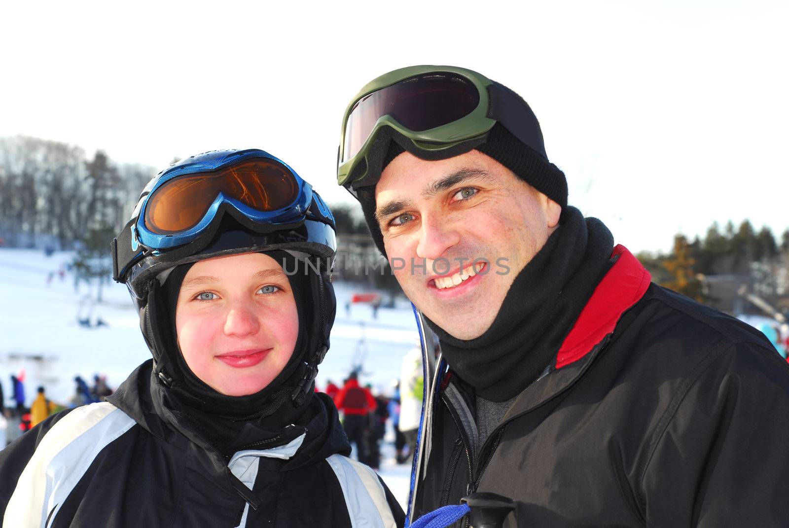 Portrait of a happy family on downhill ski resort