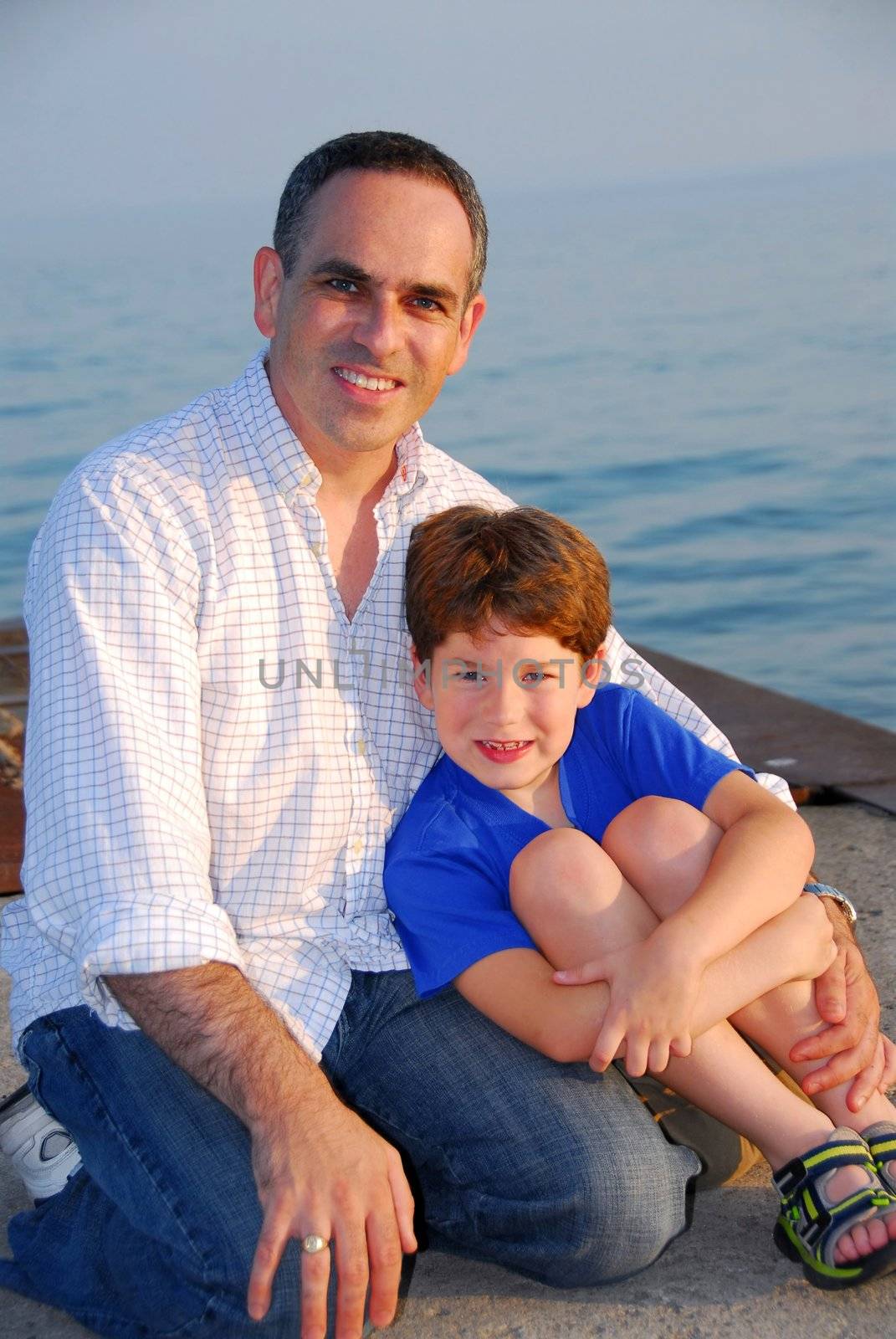 Portrait of a father and son on a pier
