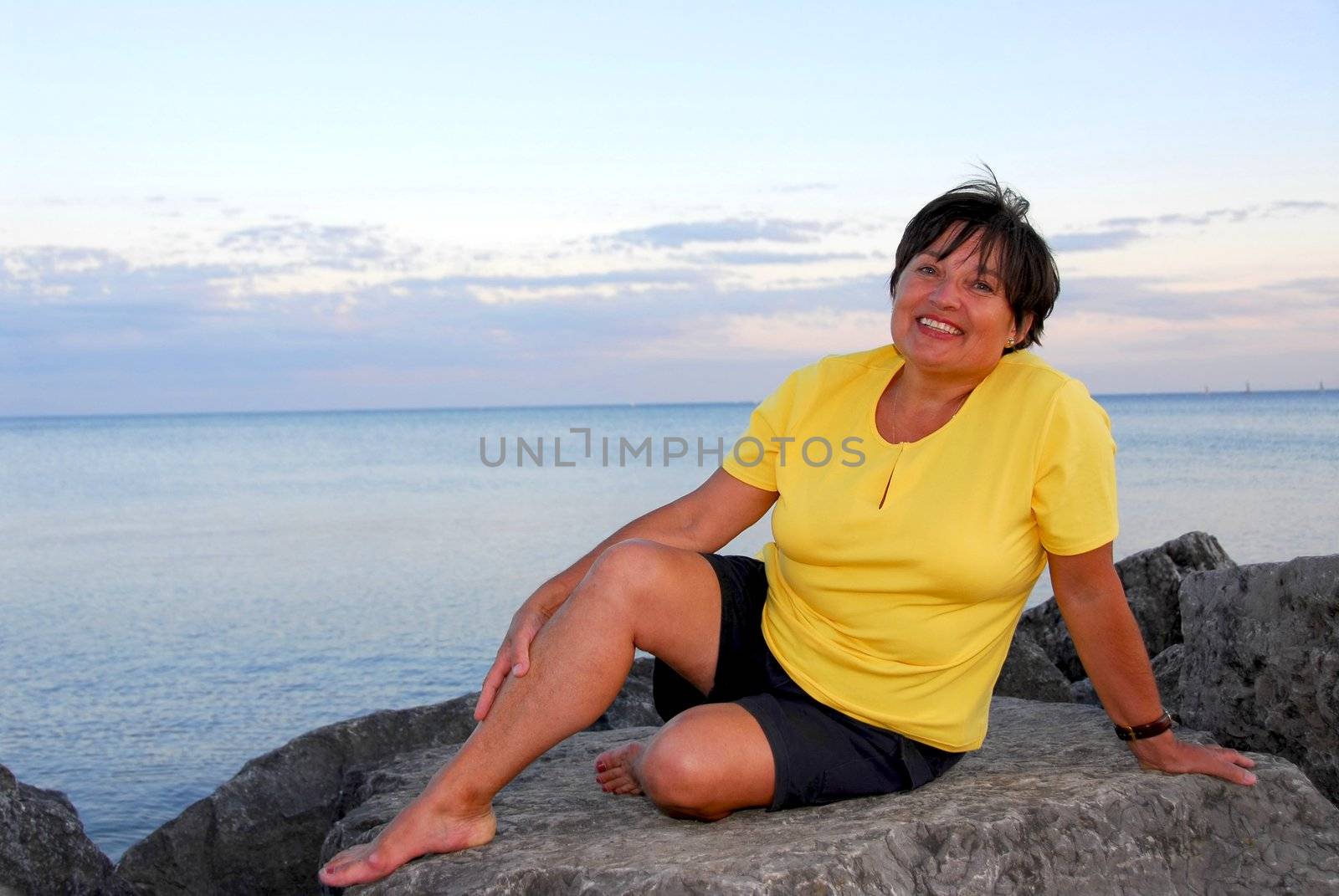 Mature woman relaxing on a shore