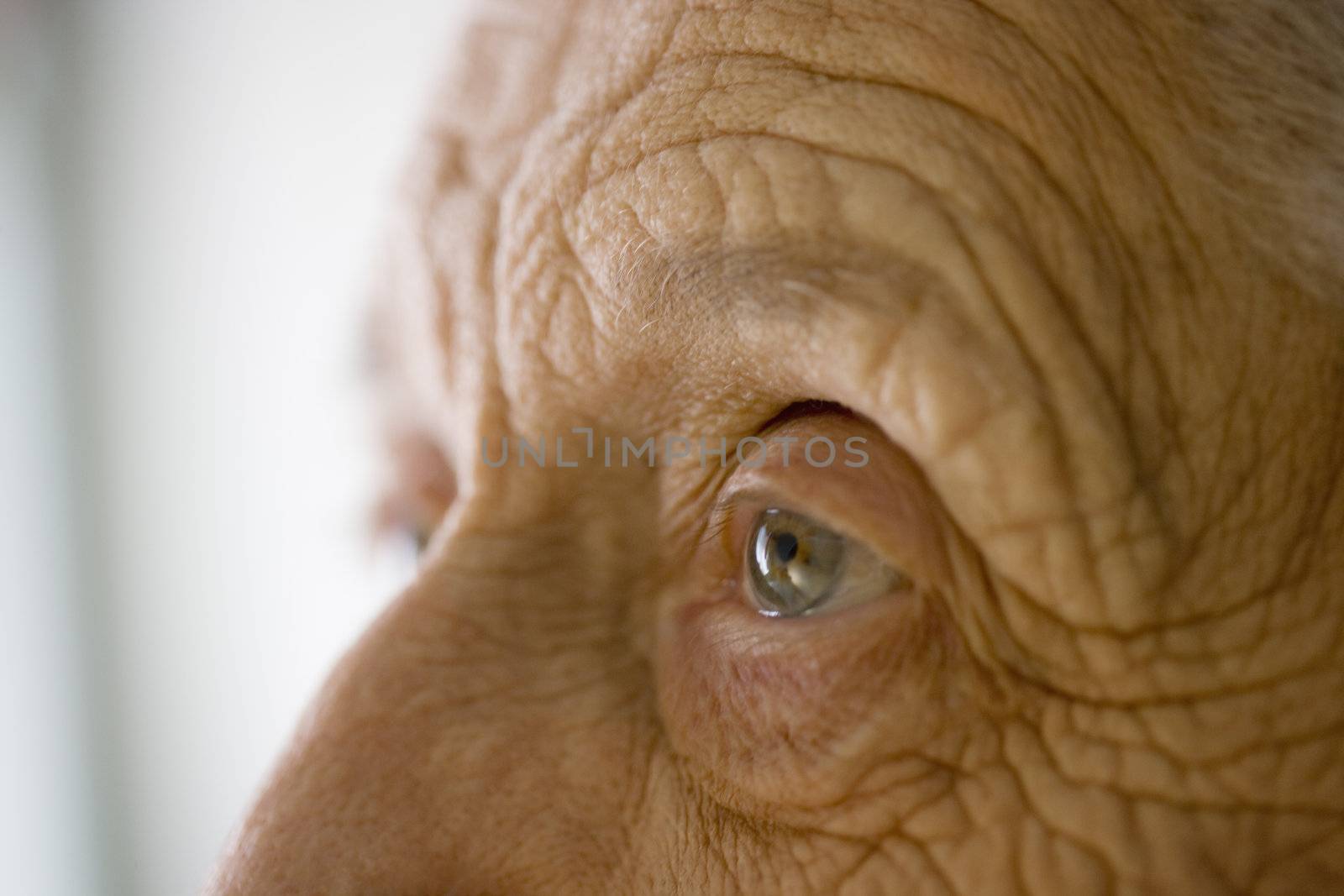 Senior woman's eye by edbockstock