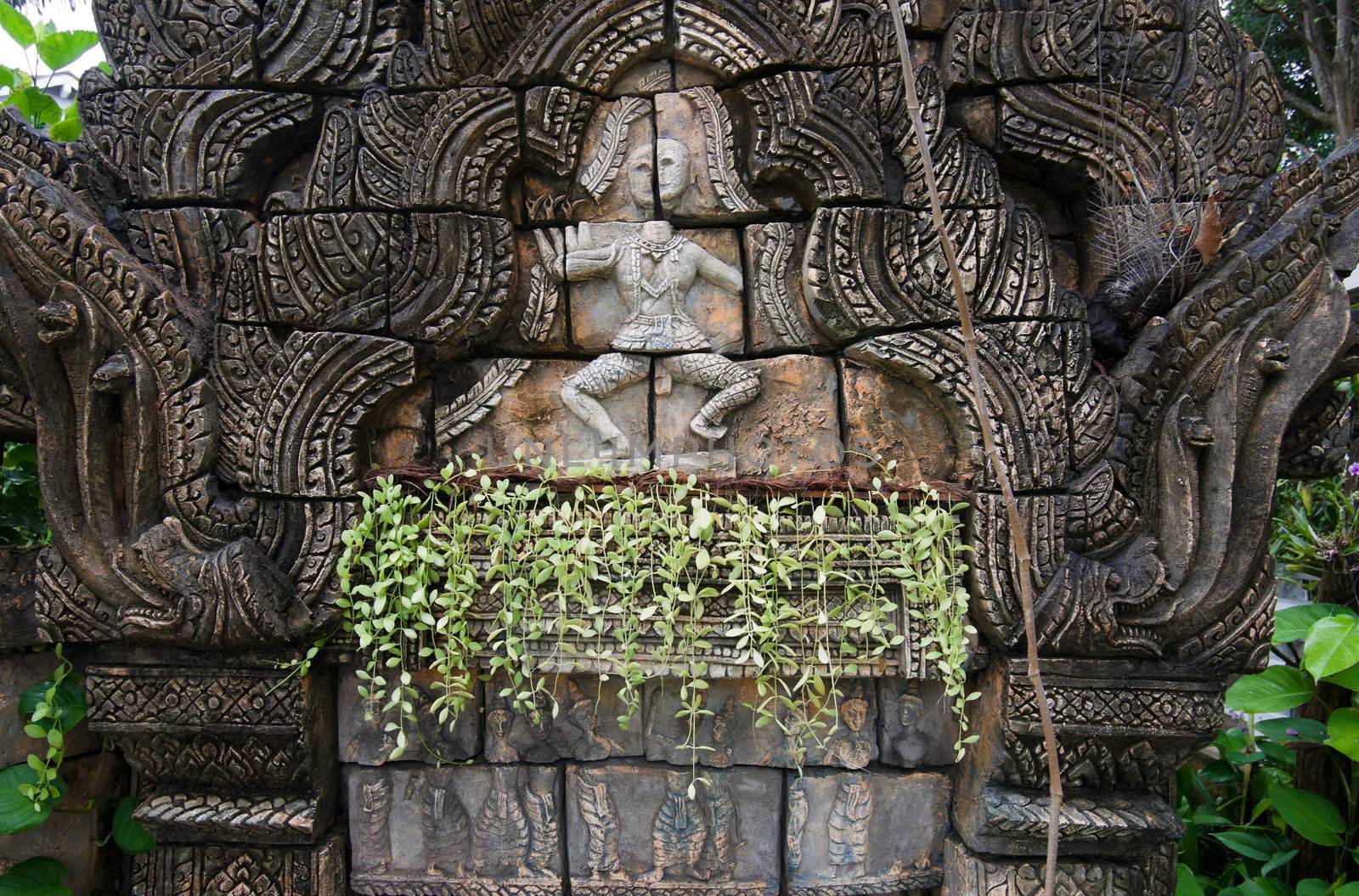 old scultpure and decorative work in wall in thailand