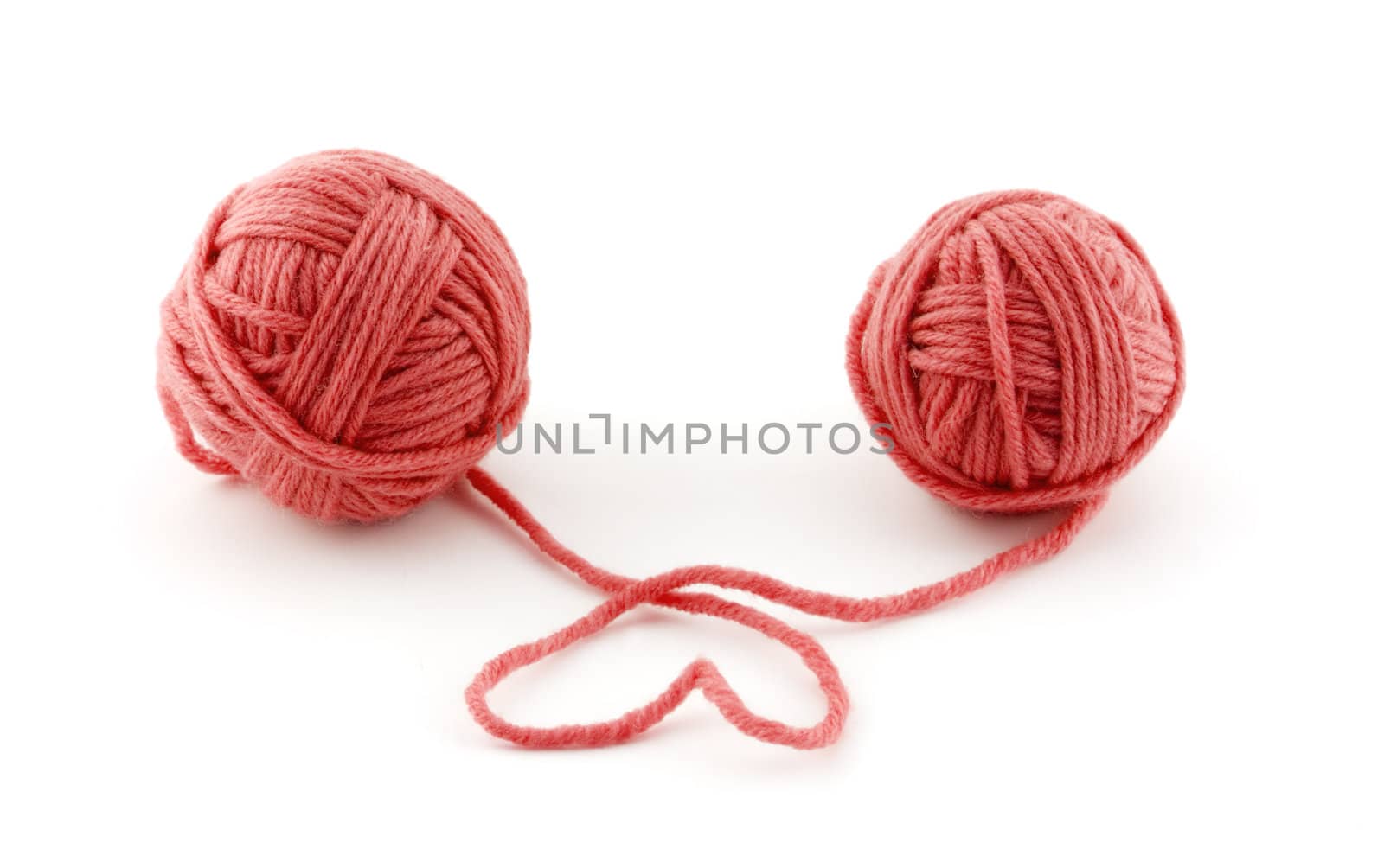 Red thread balls isolated on white background