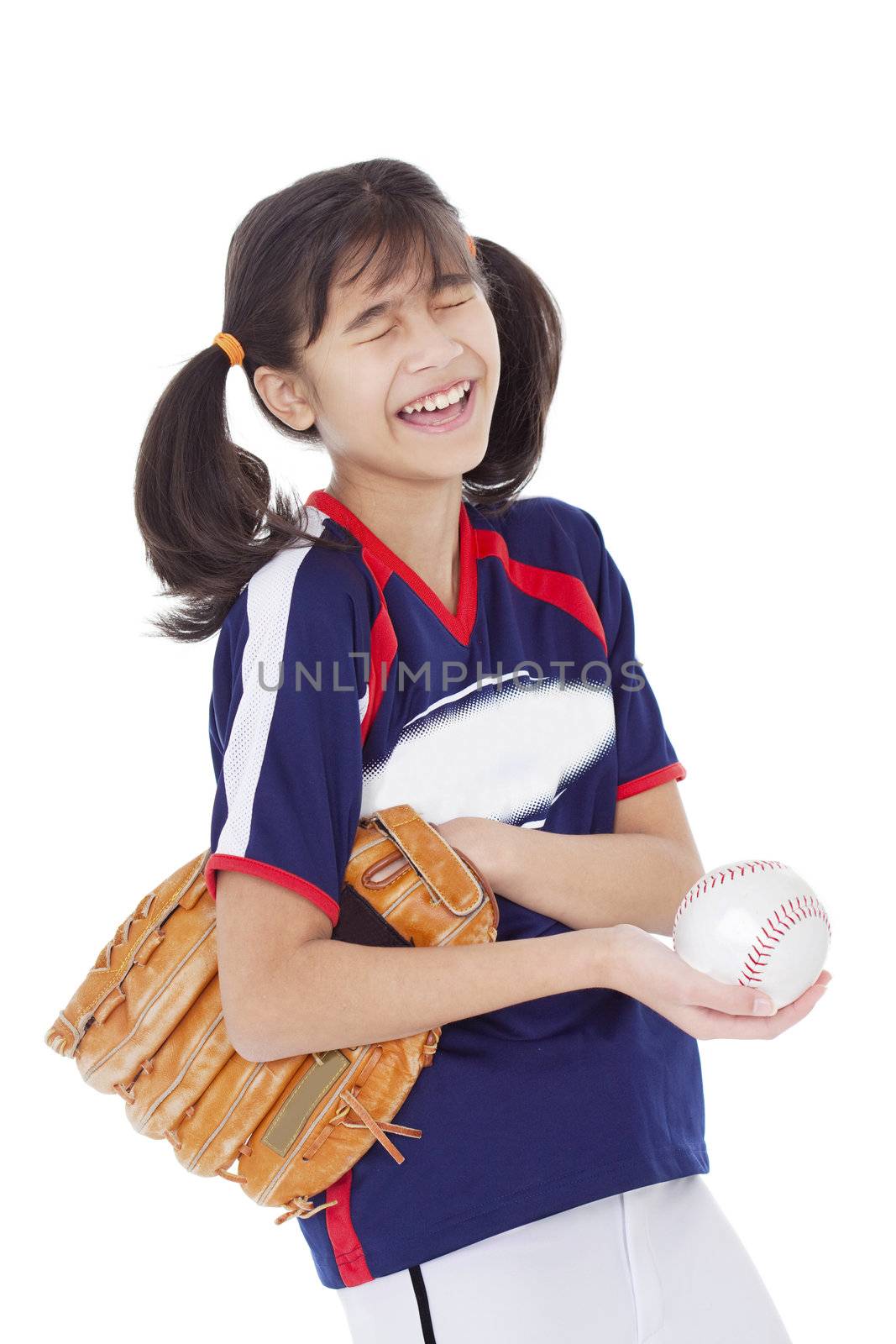 Biracial asian girl laughing while holding softball and mitt, isolated
