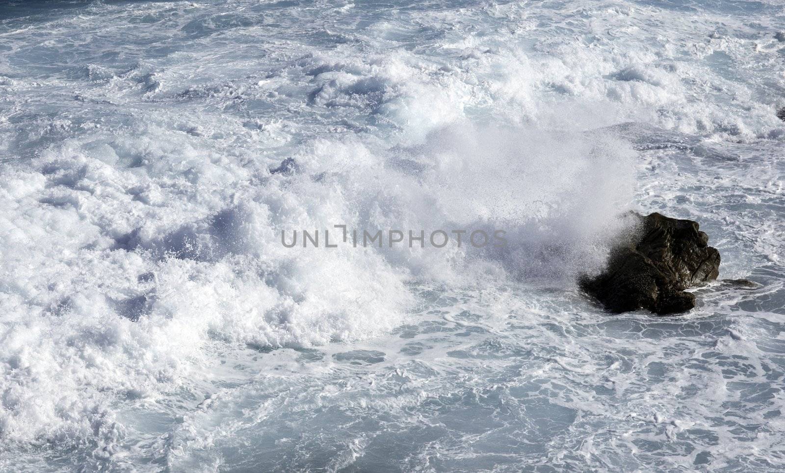 ocean waves crashing on rocks by clearviewstock