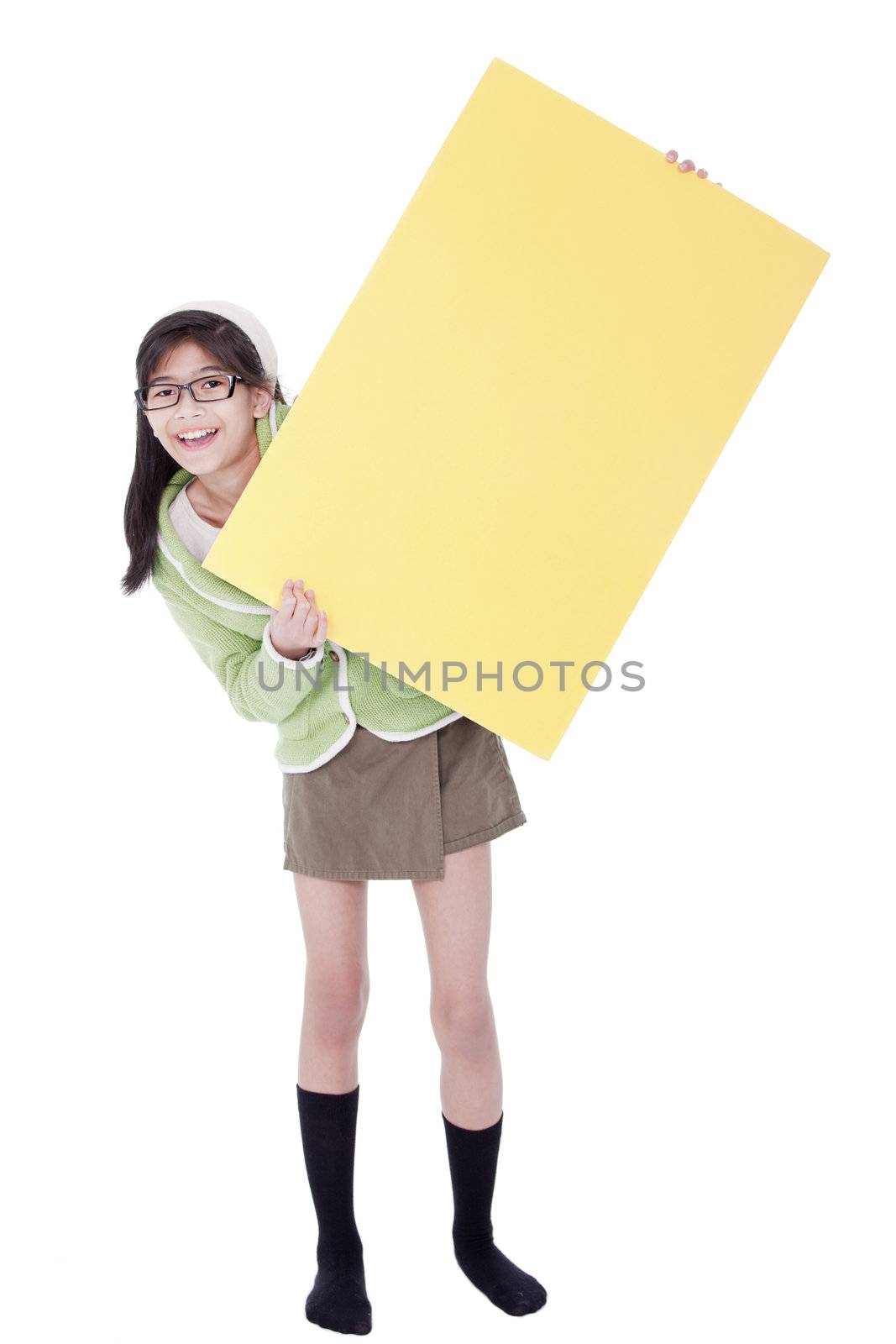 Biracial asian girl in green sweater and glasses holding blank yellow sign, isolated