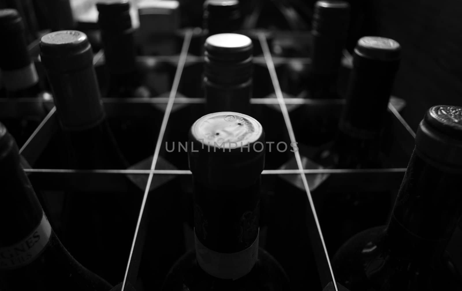 Monochrome, close upward view of wine rack