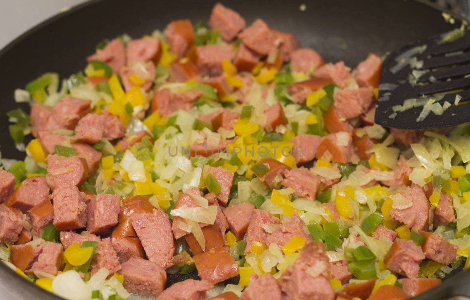 sauteed green, yellow bell pepper, sausage, and yellow onion