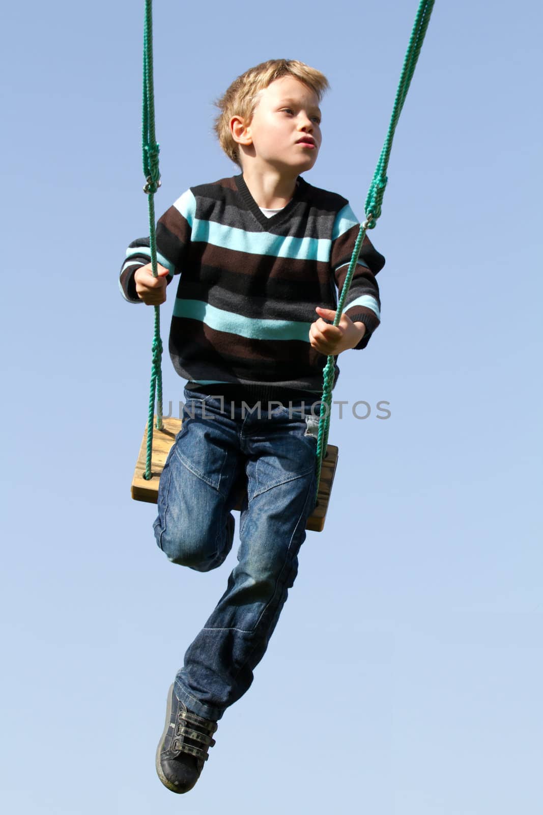 Happy child on a swing