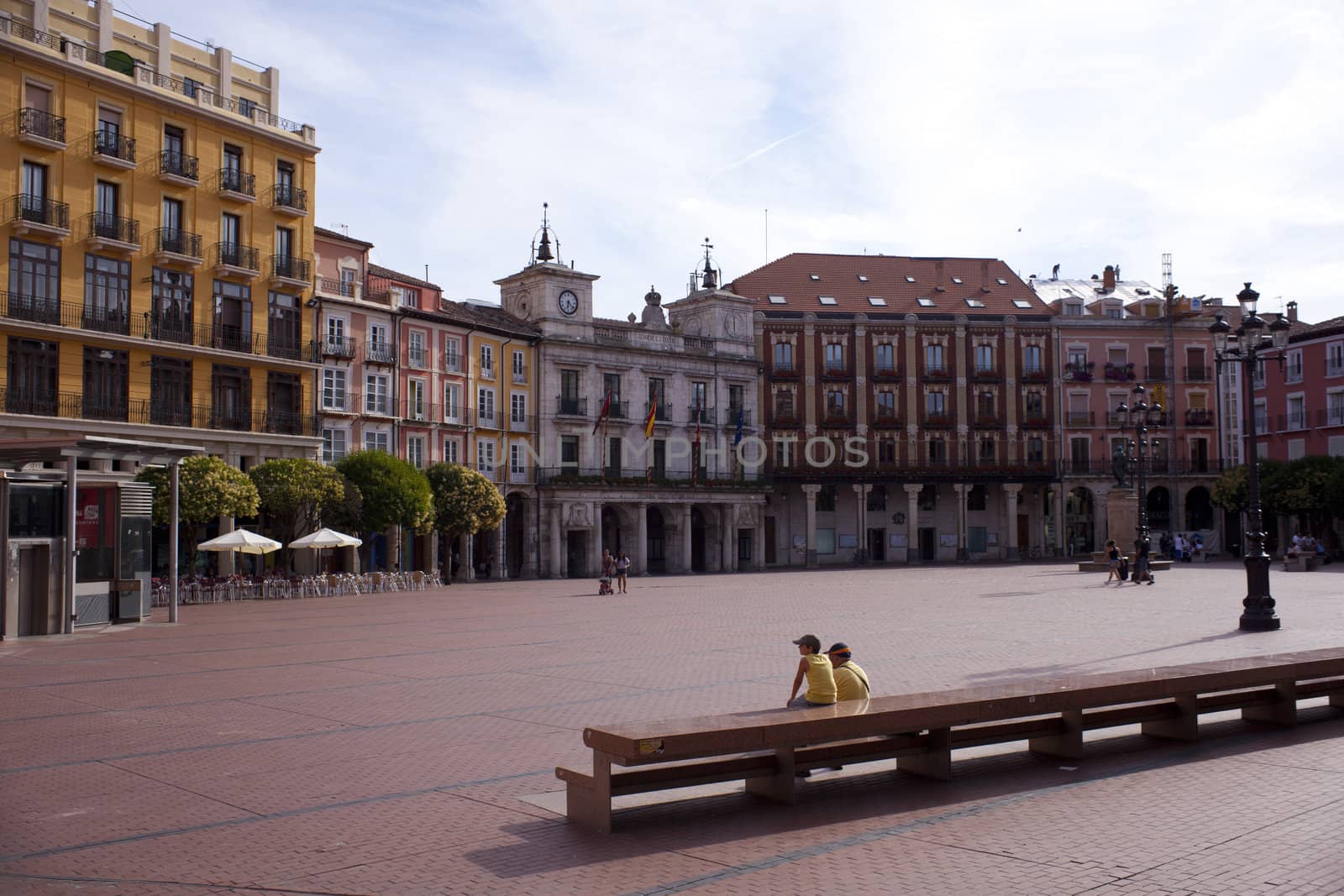People sitting in the Burgos square